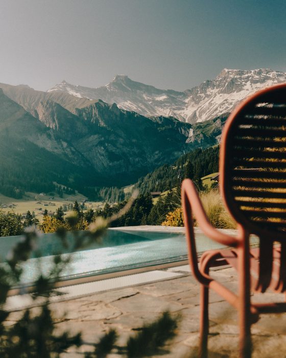 Outdoor infinity pool with Alpine mountain views at The Brecon Adelboden, Switzerland