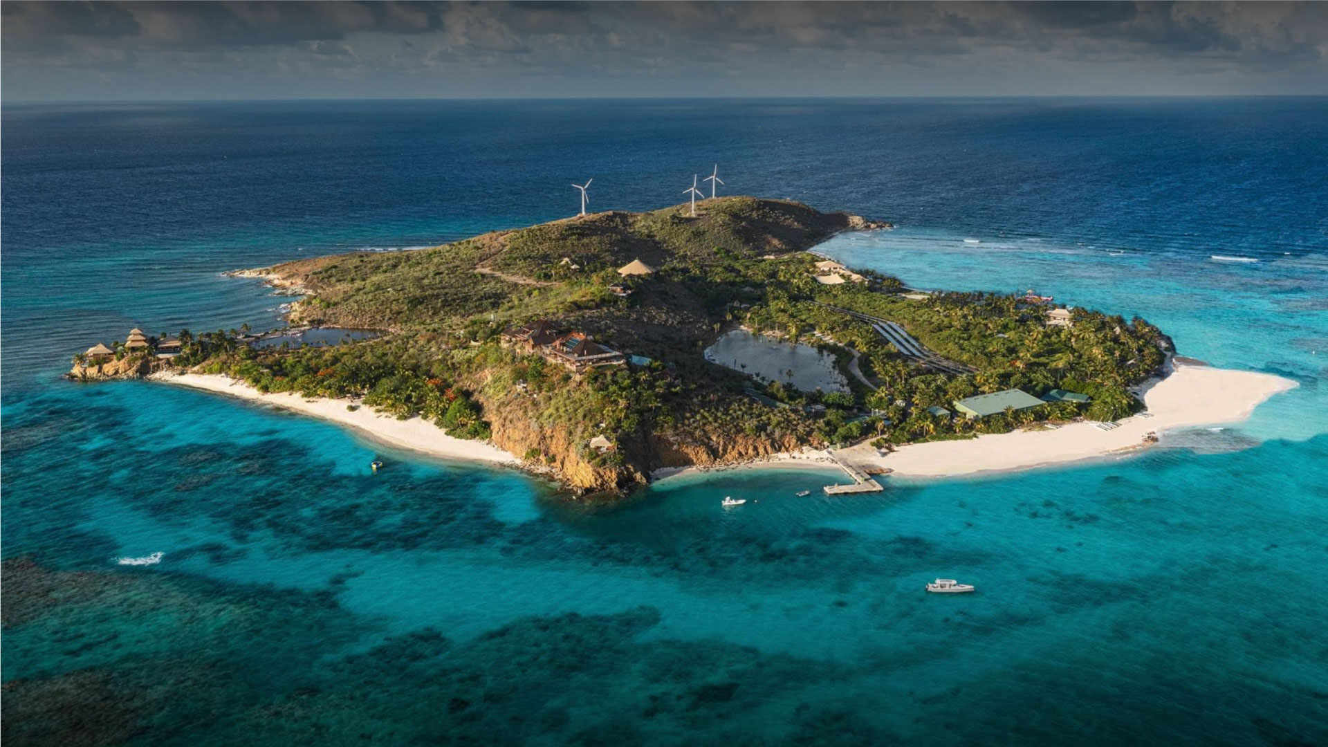Aerial view of Necker Island surrounded by turquoise Caribbean water