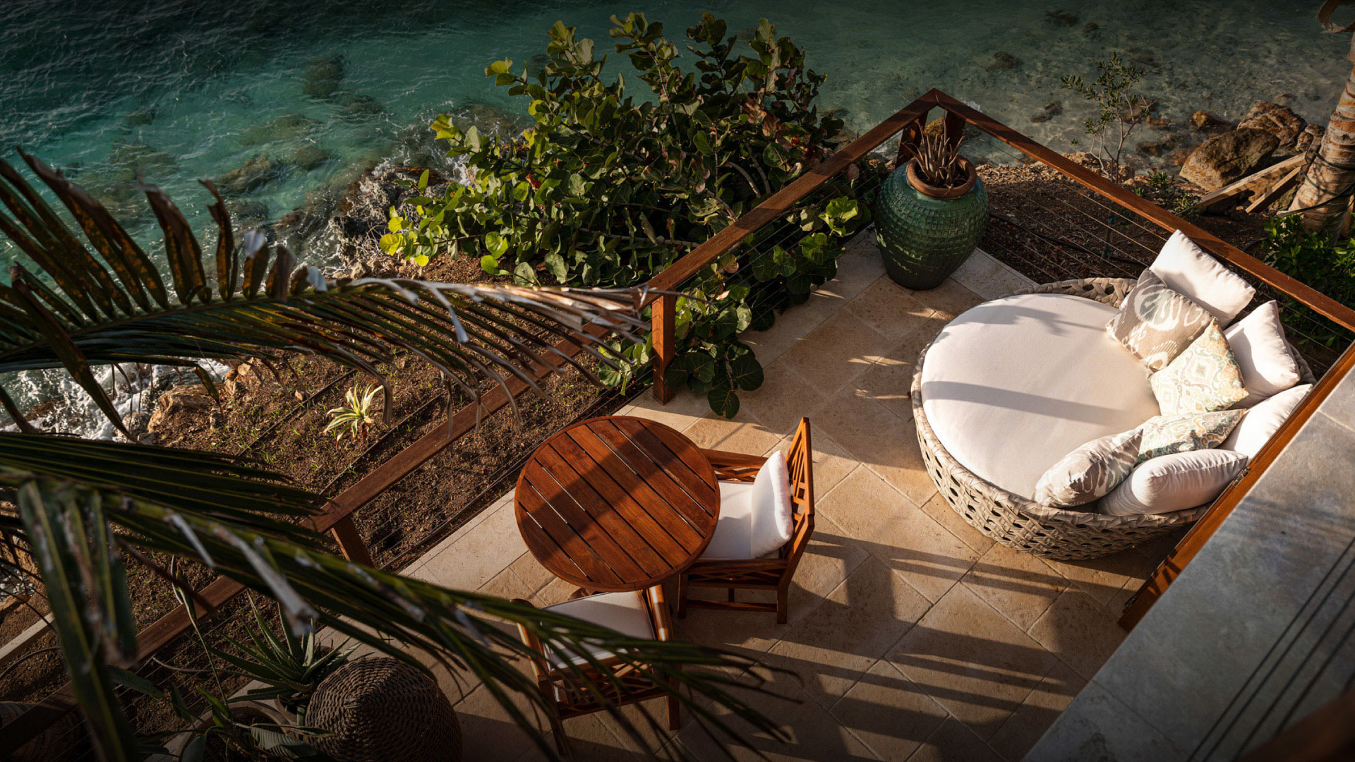 Private terrace with lounge seating and panoramic turquoise ocean view at Necker Island