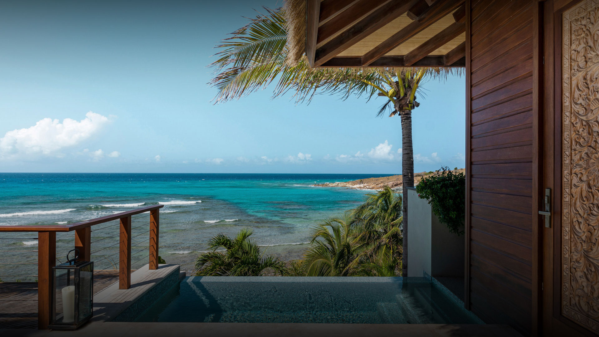 Private plunge pool with ocean view beside a villa at Necker Island