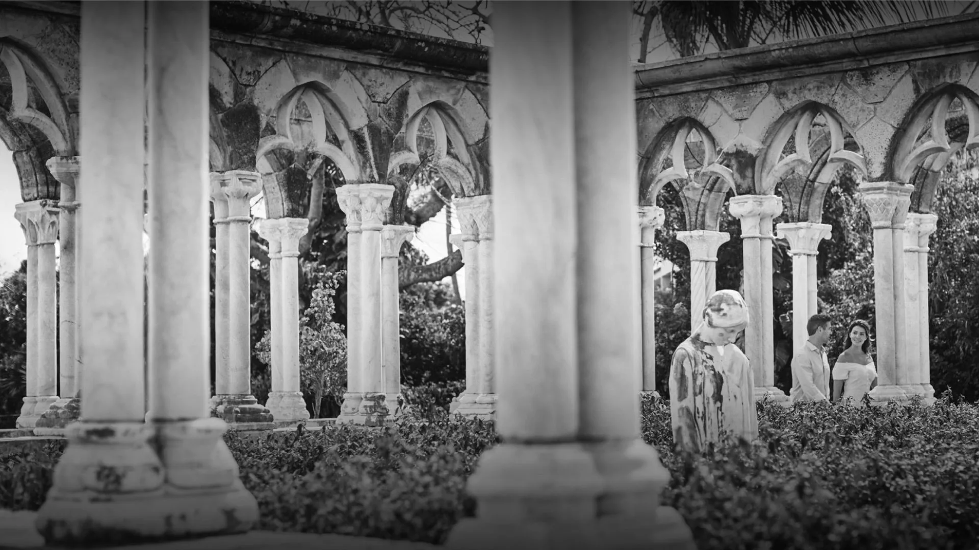 Couple walking through the Versailles-inspired cloisters at Four Seasons Ocean Club, Bahamas