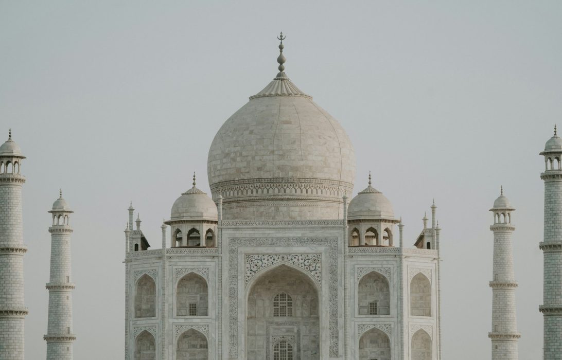 The Taj Mahal's central dome and minarets against an overcast sky, Agra
