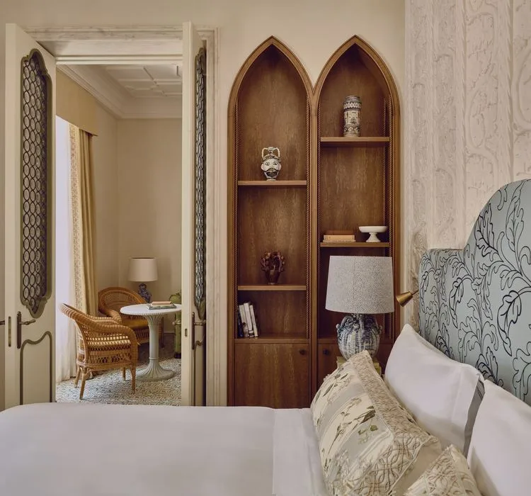 Bedroom with carved wooden shelves at Grand Hotel Timeo, A Belmond Hotel, Taormina