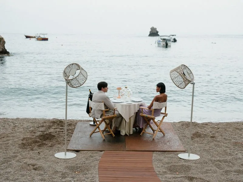 Private candlelit dinner on the beach at Villa Sant'Andrea, A Belmond Hotel, Taormina Mare